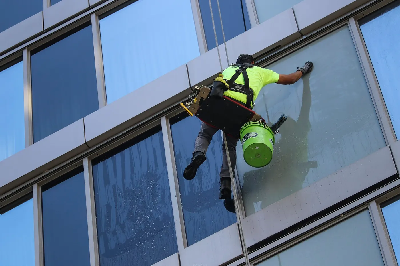 Window cleaners on a high-rise facade